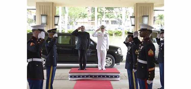 Men saluting. (Photo Credit: MC1 Jay M. Chu)