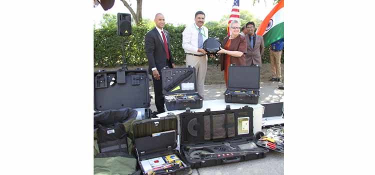 Group of people with various types of equipment. (Photo Credit: State Department)