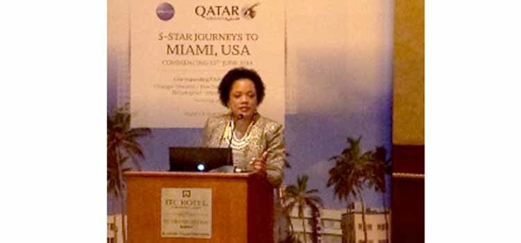 Woman speaking at a podium. (Photo Credit: State Department)