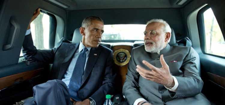 Two men riding in a car talking. (Photo Credit: The White House)