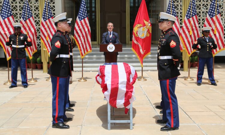 Ambassador Garcetti with a few marines at the front of U.S. Embassy New Delhi