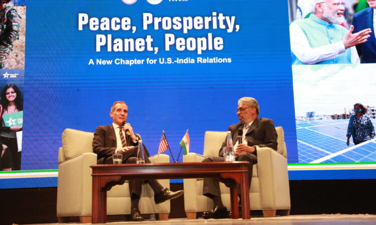 Photo of Ambassador Garcetti and C.Raja Mohan sitting on stage at the Ambassador's policy speech event.